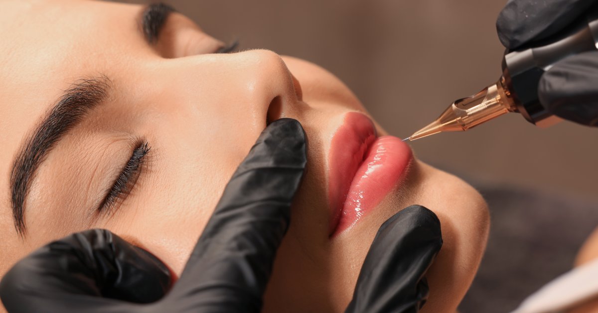 A closeup on a woman's face as she's receiving a permanent lip makeup procedure from a small needle tool.
